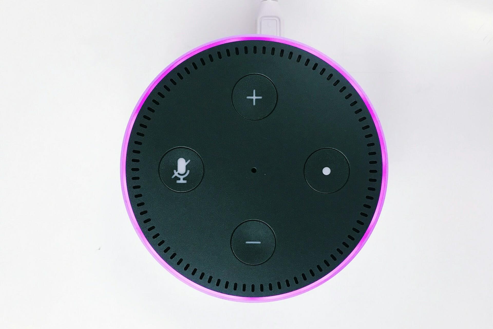 Amazon Echo Dot IoT device on white surface