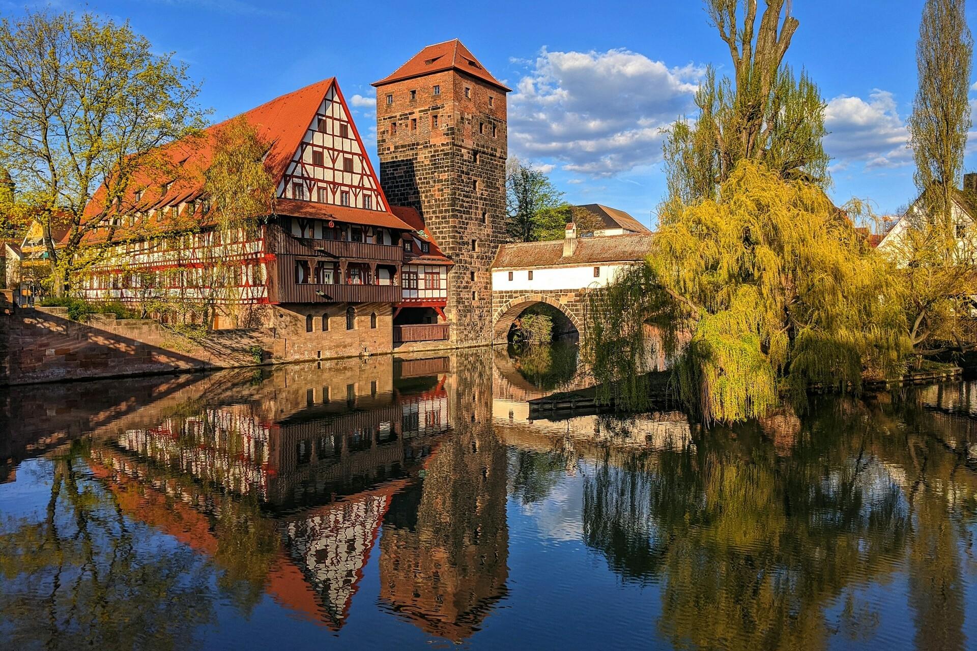 Nürnberg Some buildings are reflected in the Pegnitz river.